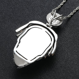 Polished back view of iced mask pendant and Bitcoin bail