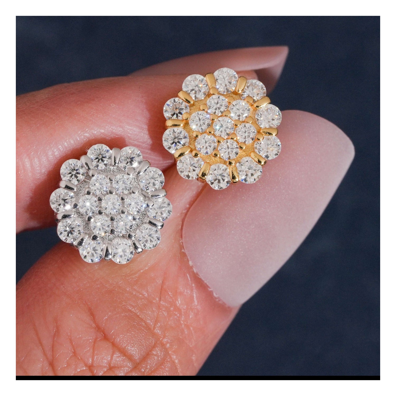 Silver and Gold flower moissanite stud earring fronts on hand