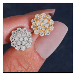 Silver and Gold flower moissanite stud earring fronts on hand