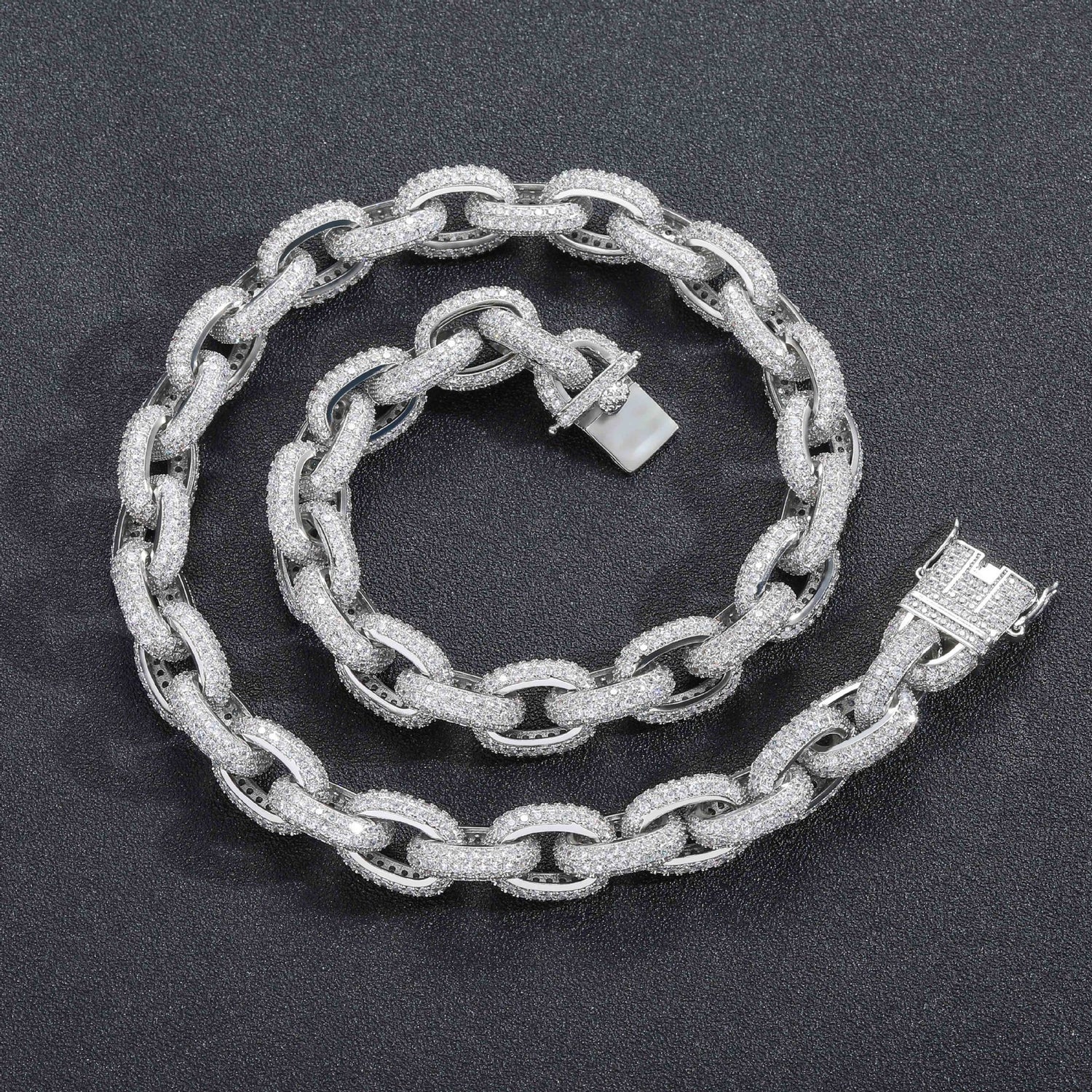 Silver iced O-link chain and bracelet on black