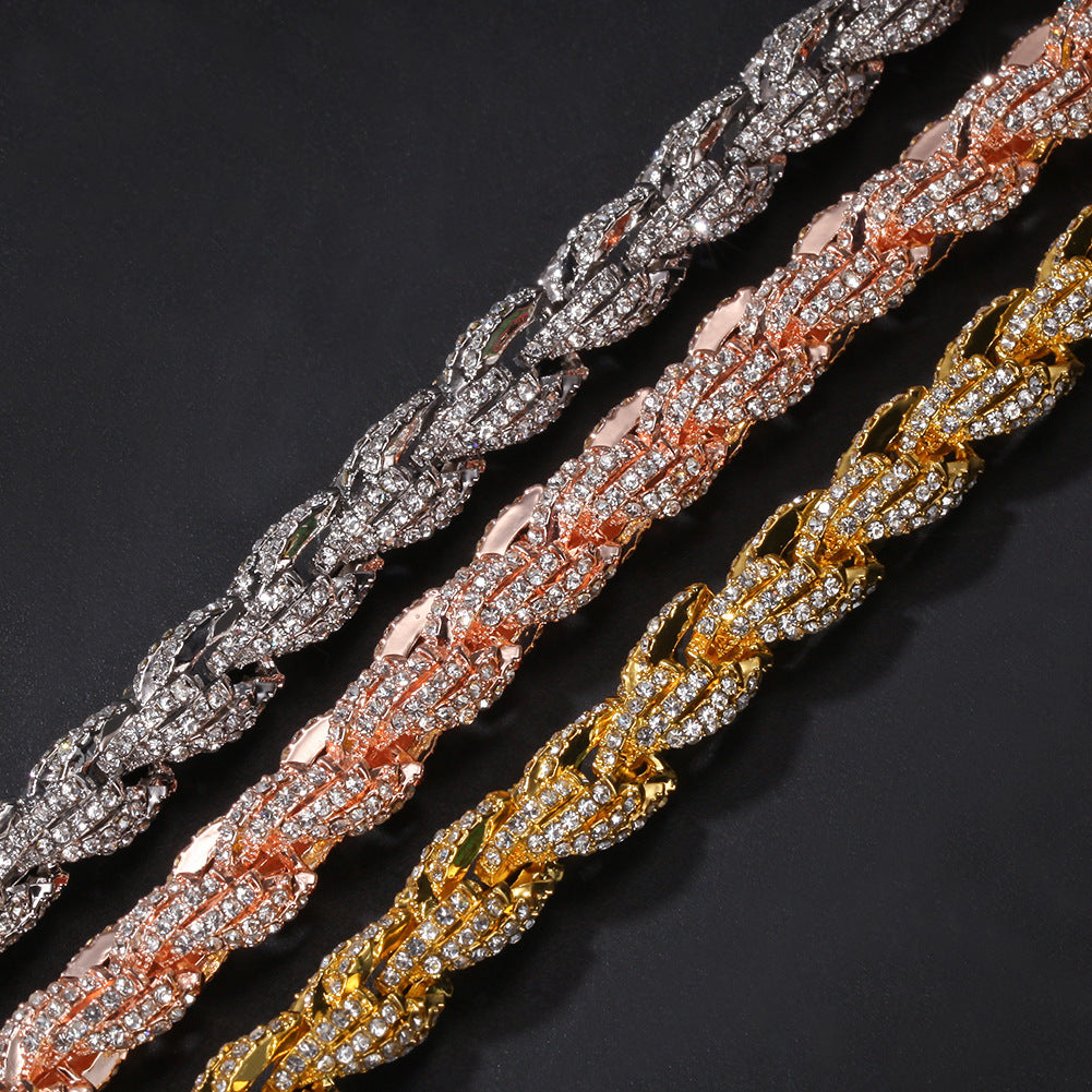 Close view of gold silver and rose gold iced twisted rope chain links