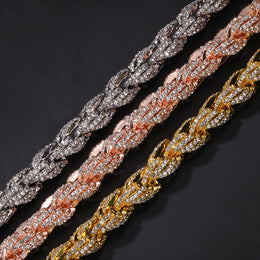 Close view of gold silver and rose gold iced twisted rope chain links
