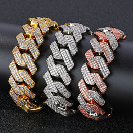 Gold, silver, and silver-pink 20mm iced Cuban link bracelets