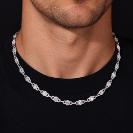 Moissanite halo link chain worn along the neckline over a black crewneck shirt