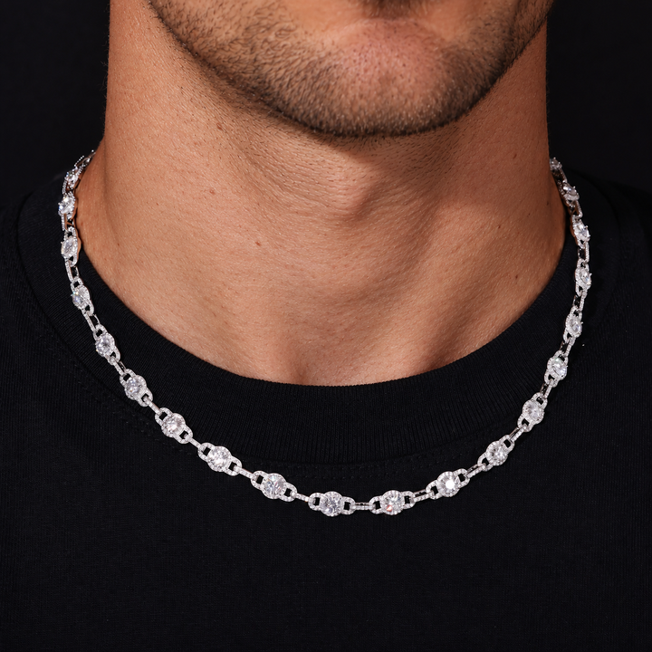Moissanite halo link chain worn along the neckline over a black crewneck shirt
