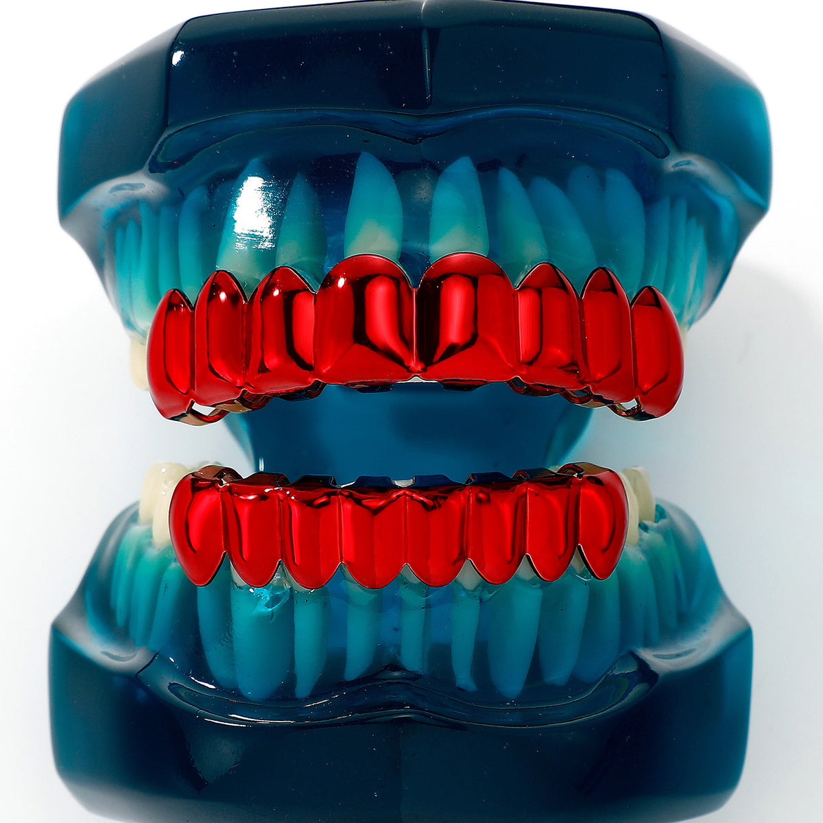 Front view of red grillz on a blue dental display model