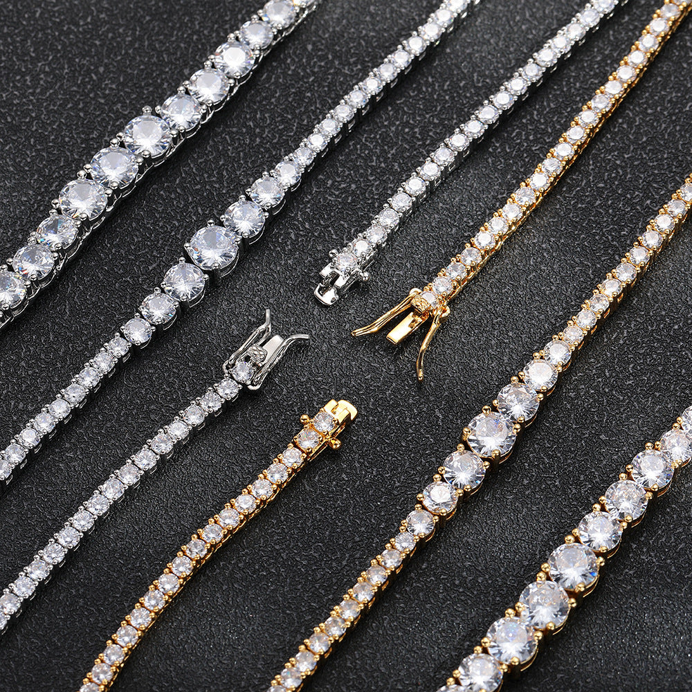 Front details and open clasps of silver- and gold-tone graduated tennis jewelry