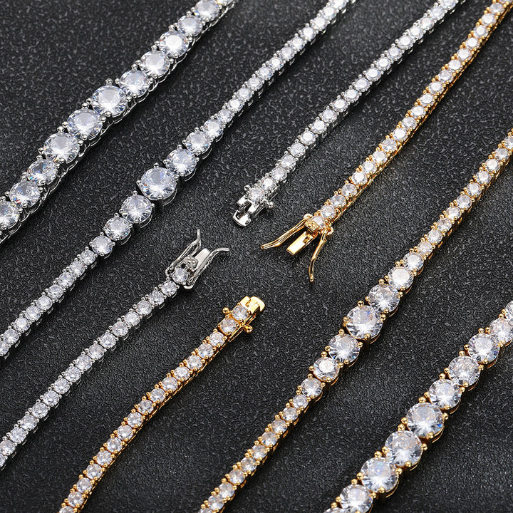 Front details and open clasps of silver- and gold-tone graduated tennis jewelry