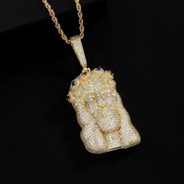 Gold iced out Jesus Piece pendant on black background
