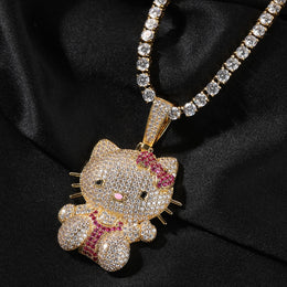 Gold iced pink bow cat pendant styled on black fabric