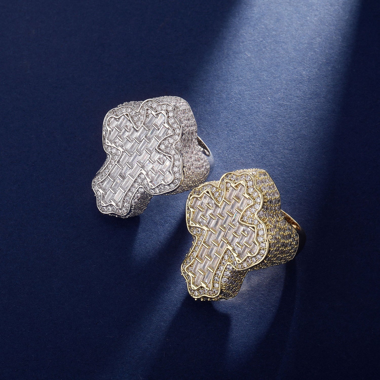 Gold and Silver vintage cross rings on a blue background