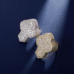 Gold and Silver vintage cross rings on a blue background