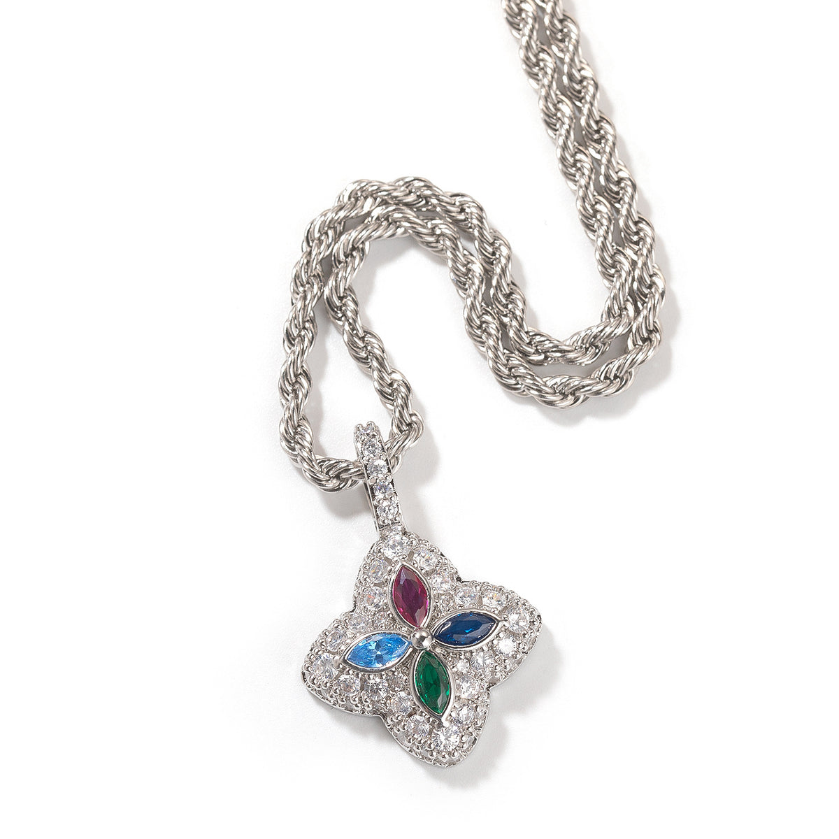 Multicolor four-leaf clover pendant in a silver-tone setting on white