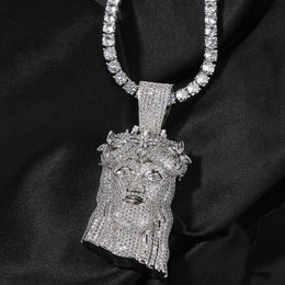 Silver-tone crowned portrait pendant with clear stones on black fabric
