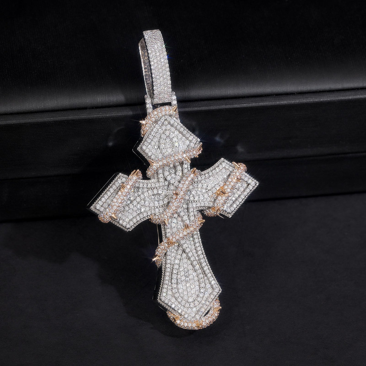 Silver and Rose Gold iced thorn-wrapped cross pendant on black
