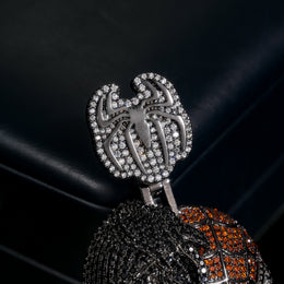 Close-up of the stone-set spider-shaped bail and split-face pendant
