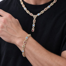 Model wearing a gold-tone multicolor lariat necklace and matching bracelet