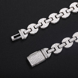 Close-up of moissanite-set mariner links and both parts of the open box clasp