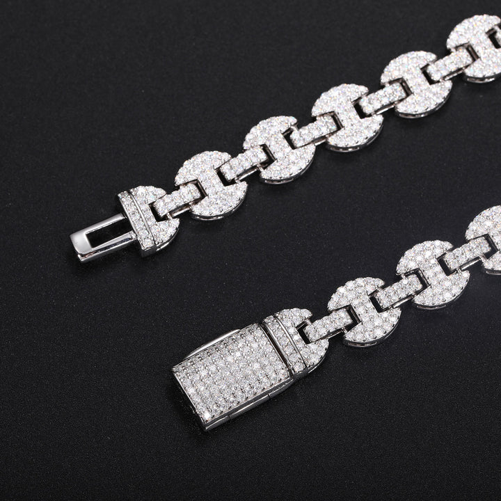 Close-up of moissanite-set mariner links and both parts of the open box clasp