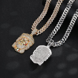 Gold-tone front and silver-tone back views of the iced Jesus pendant