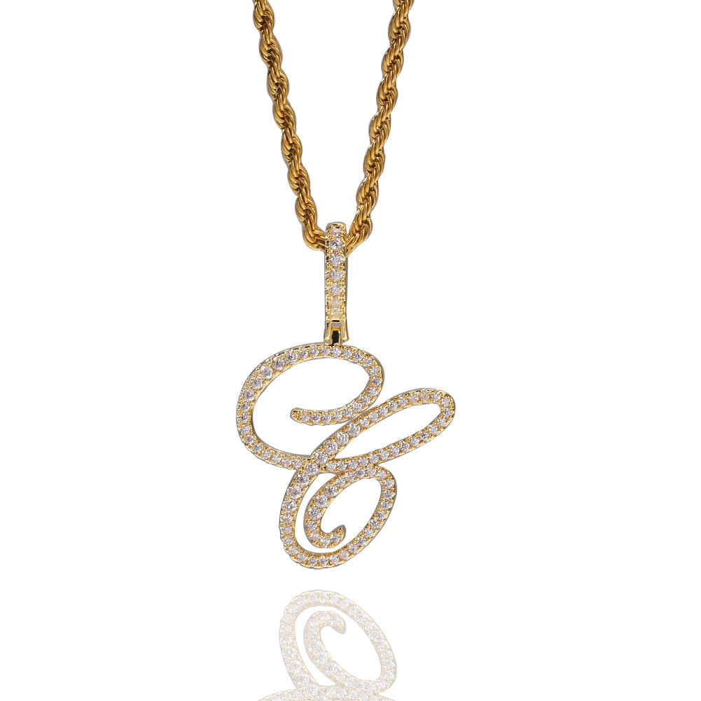Gold-tone cubic zirconia script letter C pendant with reflection on white