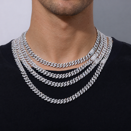 Adult model wearing layered silver-tone moissanite Cuban chains over a black shirt