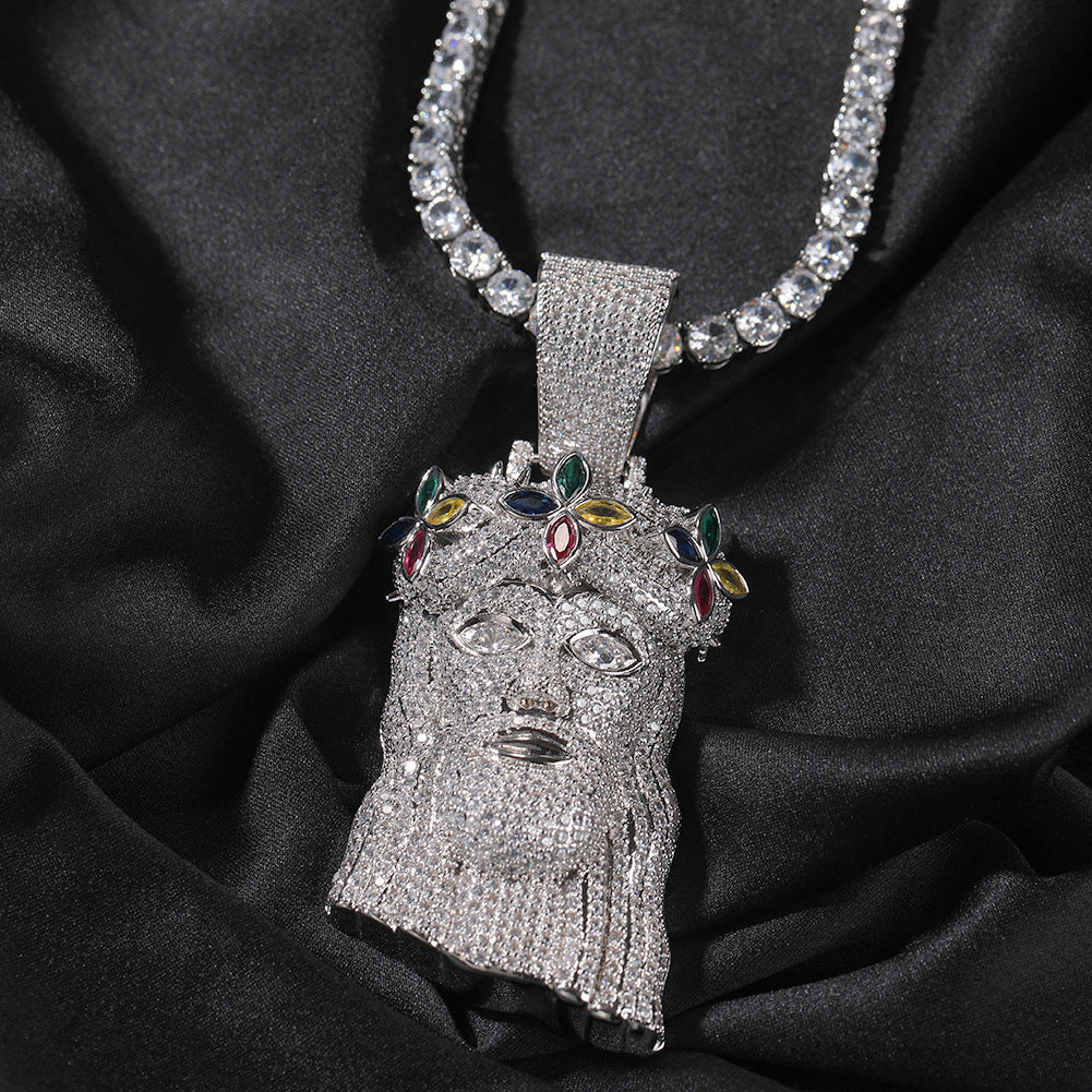 Silver-tone crowned portrait pendant with multicolor stones on black fabric