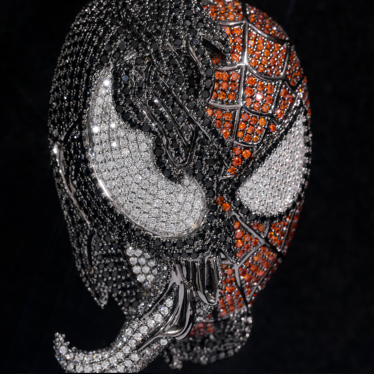 Close-up of black, white and orange cubic zirconia details