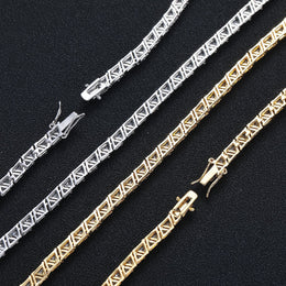 Open backs of triangular settings and safety clasps in silver and gold tones