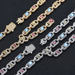 Open clasps and multicolor geometric links on silver- and gold-tone jewelry