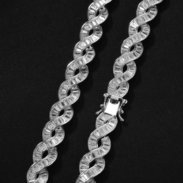 Closed box clasp and baguette-set spiral links on black fabric