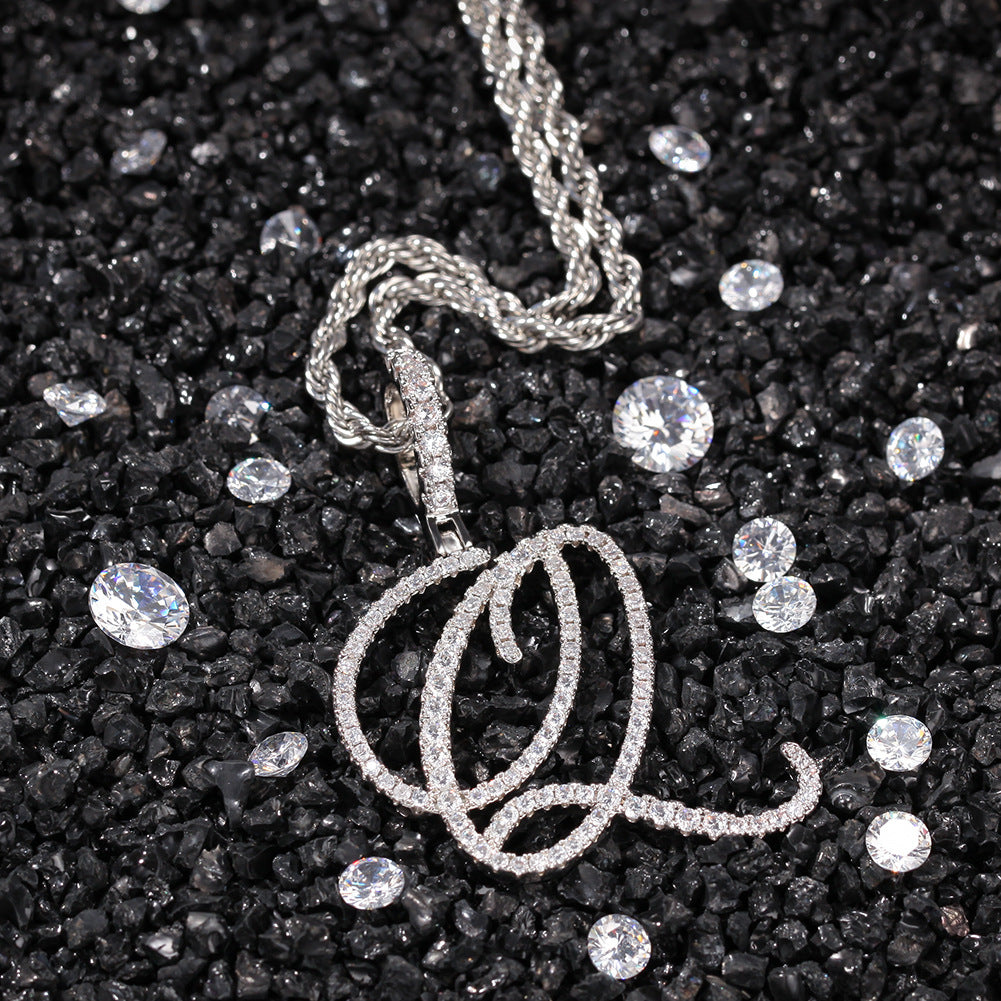 Silver-tone cubic zirconia script letter O pendant on black stones
