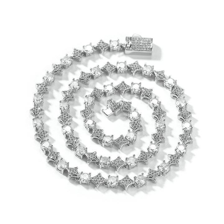 Silver-tone stone-set star-link necklace coiled with its clasp open
