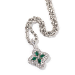 Emerald-green four-leaf clover pendant in a silver-tone setting on white