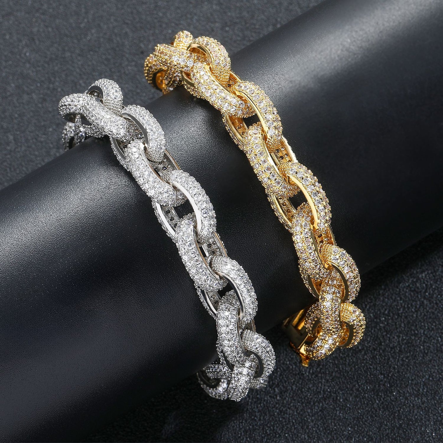 Silver and gold iced O-link bracelets displayed together