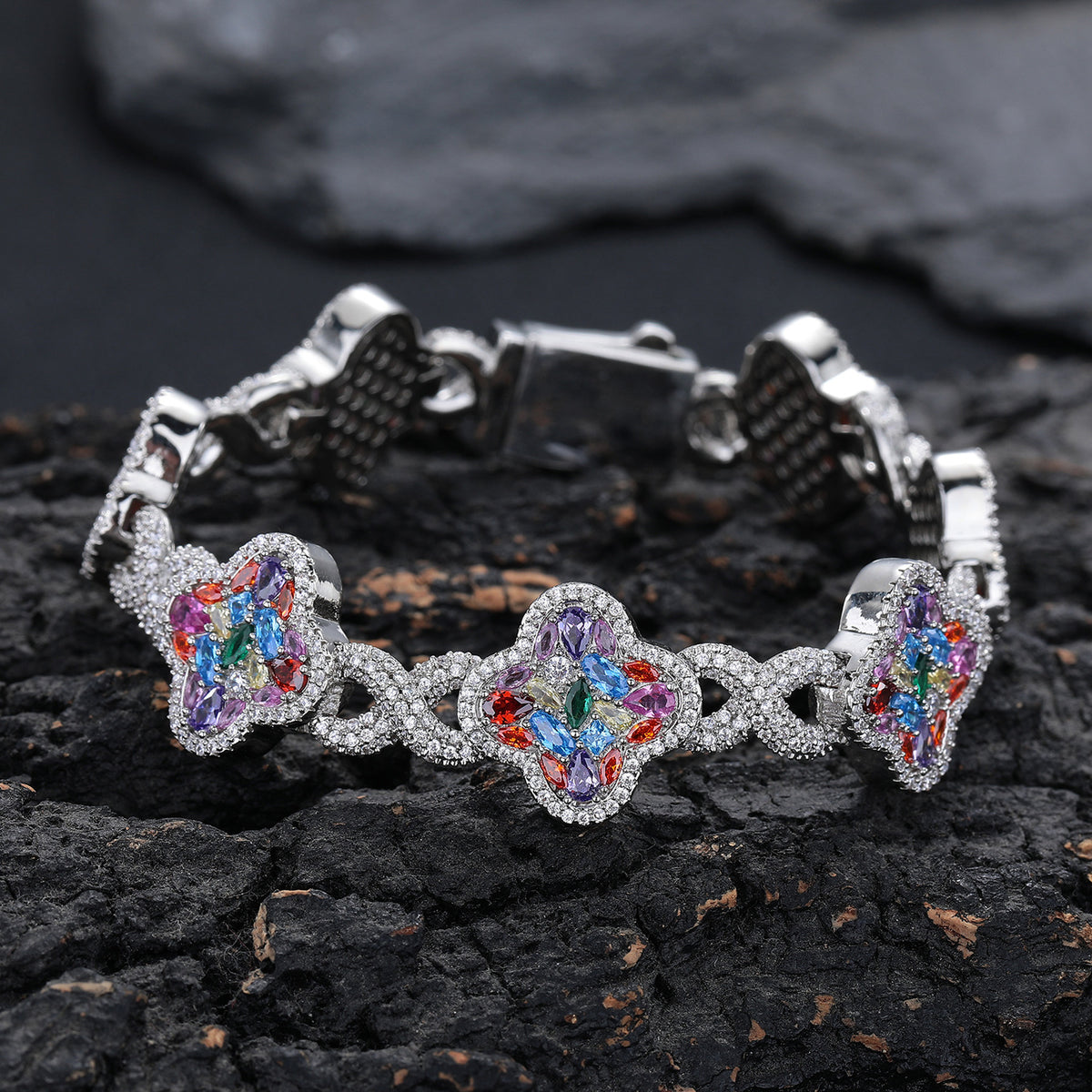 Silver-tone multicolor zircon clover bracelet on black rock