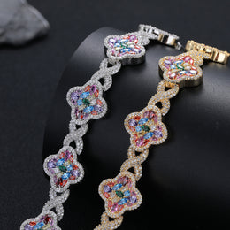 Silver-tone and gold-tone multicolor clover bracelets, angled view