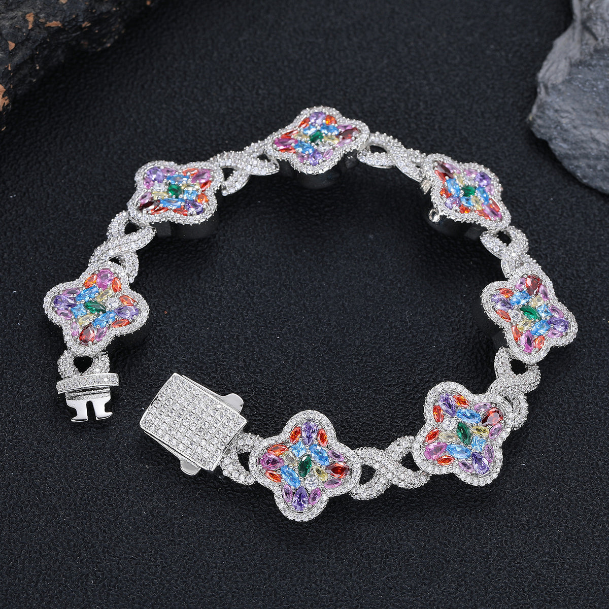 Silver-tone multicolor zircon clover bracelet laid flat