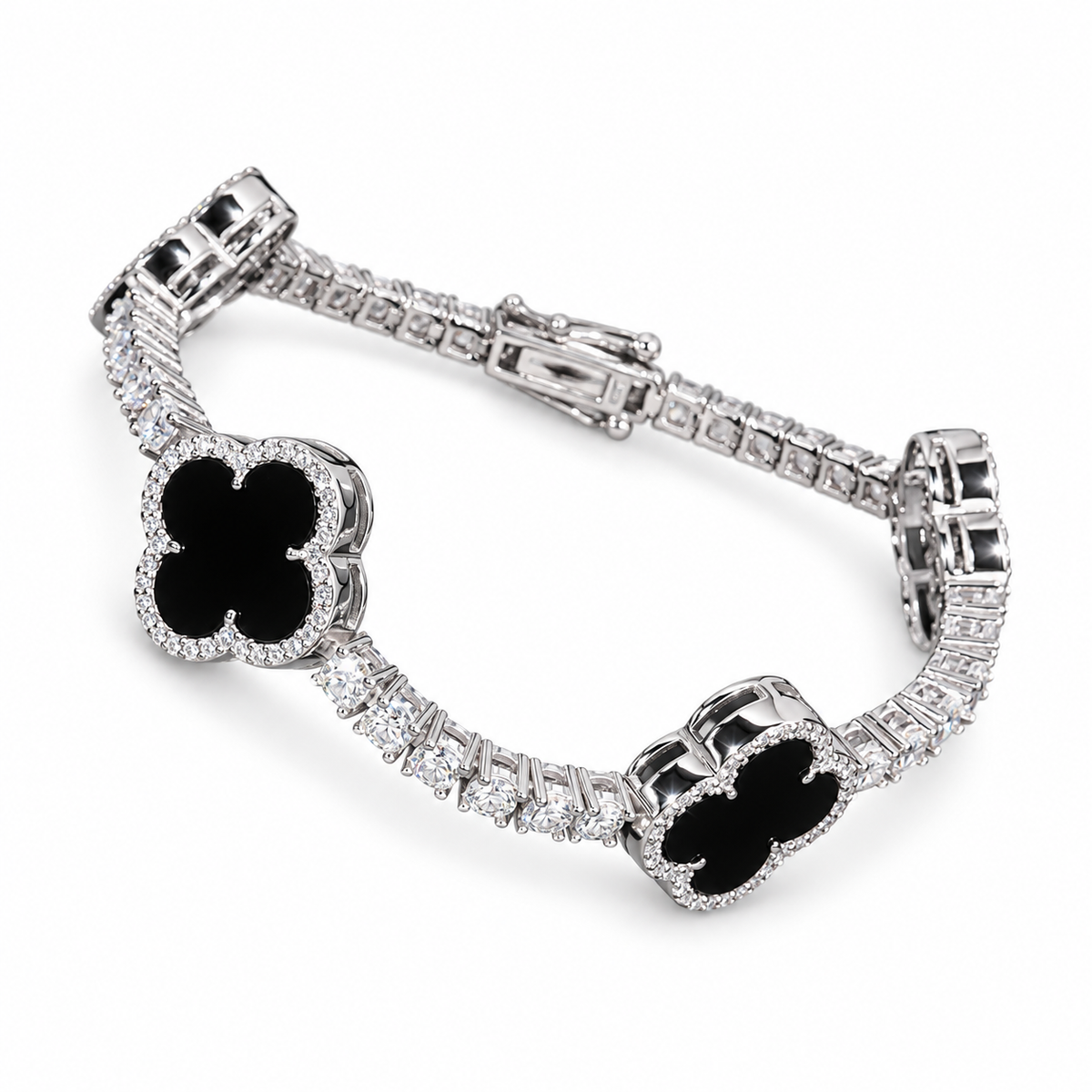 Silver-tone tennis bracelet with black clover inlays on white