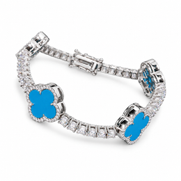 Silver-tone tennis bracelet with blue clover inlays on white