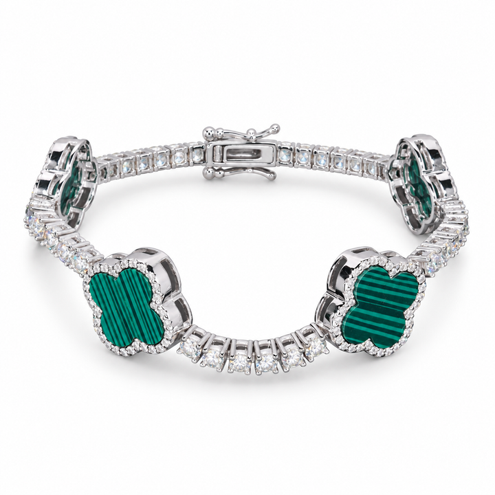 Silver-tone tennis bracelet with striped green clover inlays on white