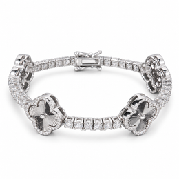 Silver-tone engraved clover tennis bracelet with clear stone halos on white