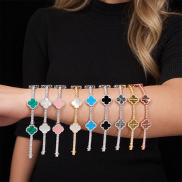 Comparison of engraved and color inlay clover bracelets displayed across an adult forearm