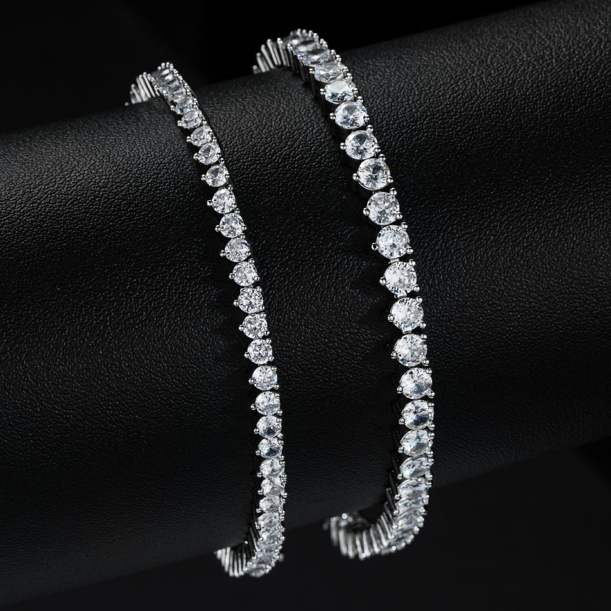 Silver-tone tennis bracelets comparing two stone widths