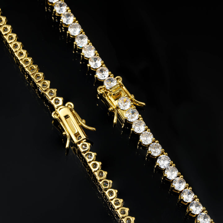Gold-tone tennis links showing triangular backs and safety clasps