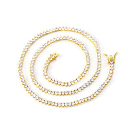 Gold-tone three-prong tennis necklace arranged in a spiral