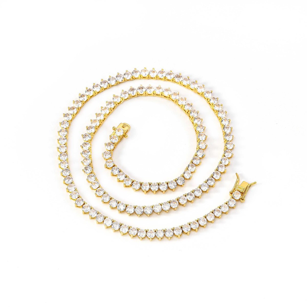 Gold-tone three-prong tennis necklace arranged in a spiral