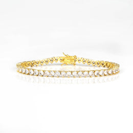 Gold-tone three-prong tennis bracelet with box clasp, front view