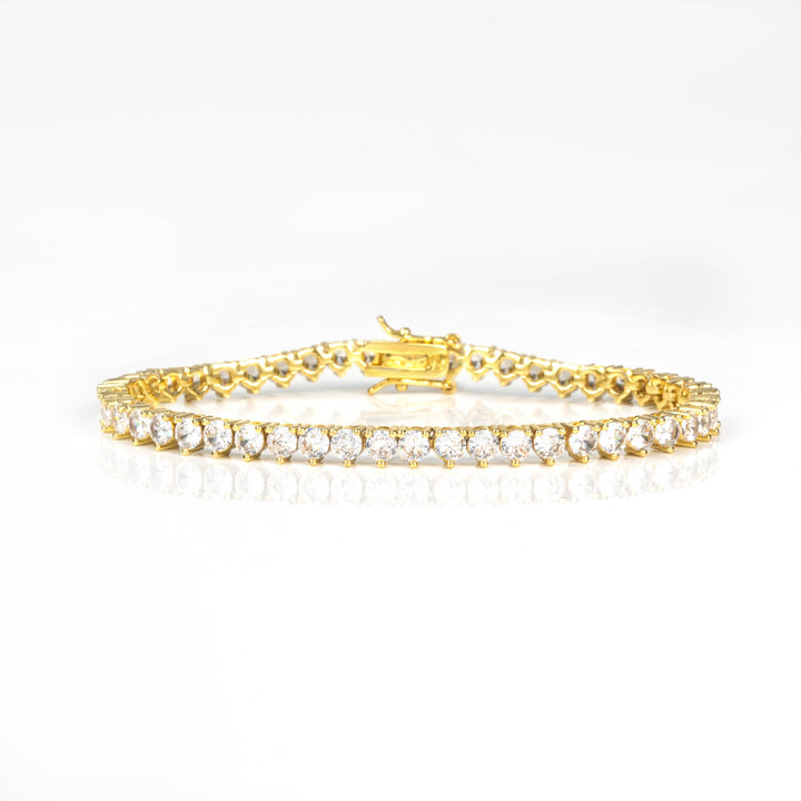 Gold-tone three-prong tennis bracelet with box clasp, front view