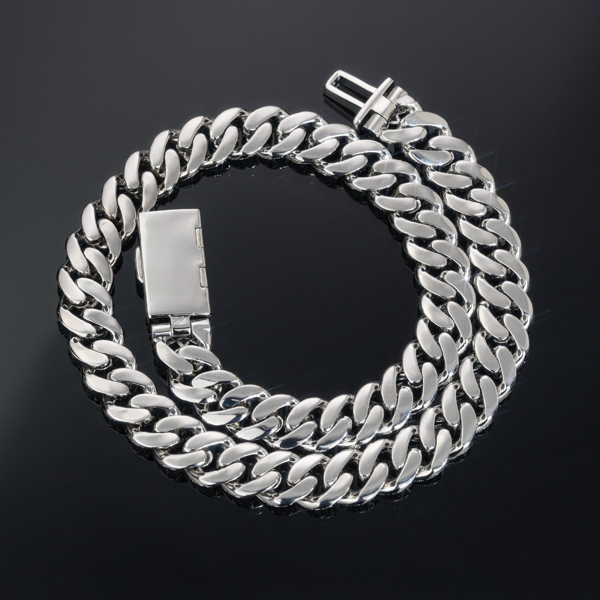Coiled silver-tone Cuban necklace showing polished link backs and the open clasp
